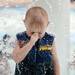Paulie Frezza, 3, of Oakland, holds his nose as he passes under a wall of water at Veterans Memorial Park Pool on Tuesday afternoon.  Melanie Maxwell I AnnArbor.com